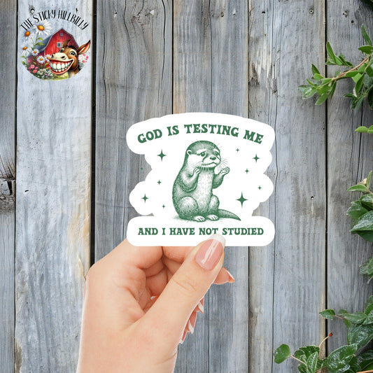 God Is Testing Me And I Have Not Studied - Cute Otter Faith Sticker | Laminated Vinyl Decal | Funny Gift Stickers | Multiple Sizes | Perfect for Laptops, Cars, Tumblers and More!